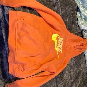 Boys size 10/12 Nike hoodie (one small hole)